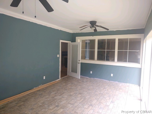 173 Lillys Neck Road Moon, VA 23119 - Photo 39 of 48 Screen porch room with ornamental molding and ceiling fan