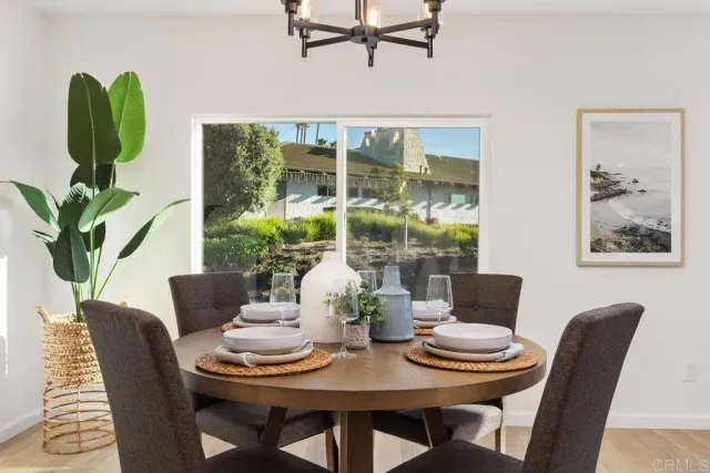 a dining room with furniture and wooden floor