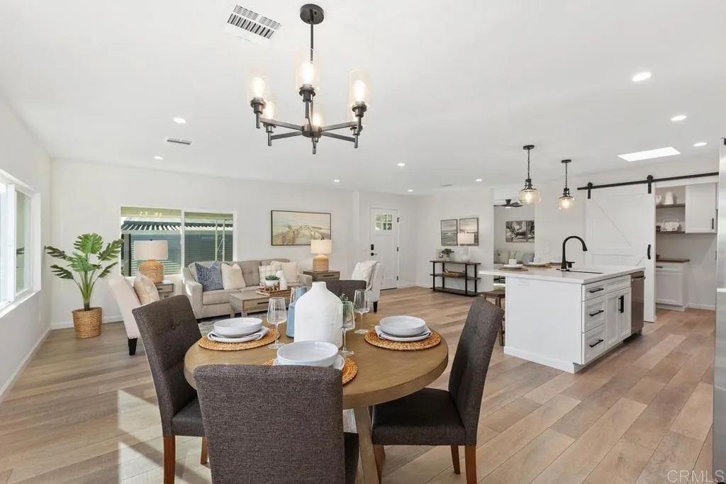 7144 Santa Rosa, Unit 86 Carlsbad, CA 92011 - Photo 15 of 41 a large kitchen with a table and chairs