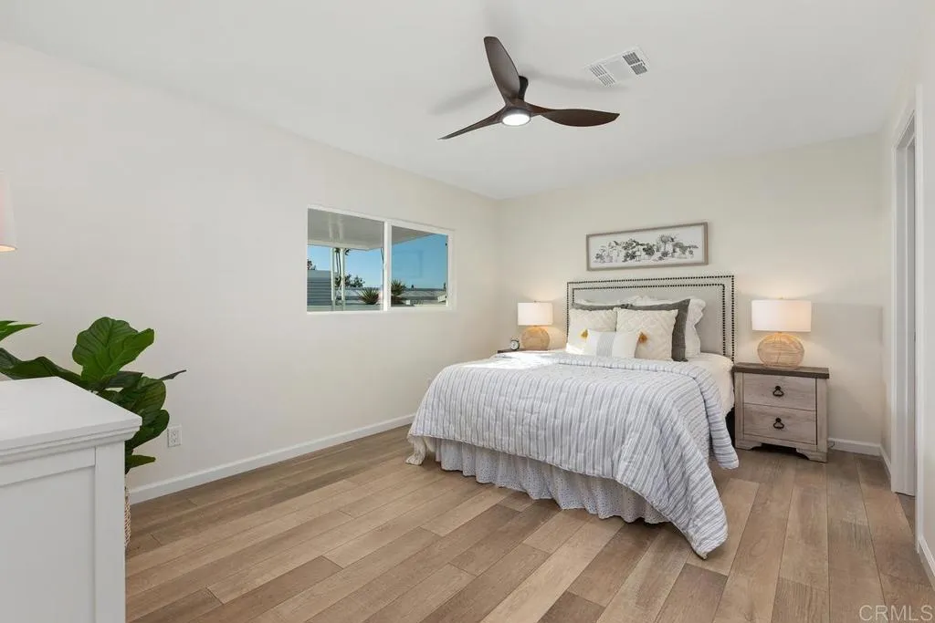 7144 Santa Rosa, Unit 86 Carlsbad, CA 92011 - Photo 20 of 41 a bedroom with a bed and a window