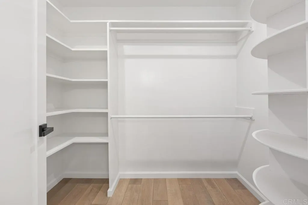 7144 Santa Rosa, Unit 86 Carlsbad, CA 92011 - Photo 25 of 41 a view of walk in closet with empty racks