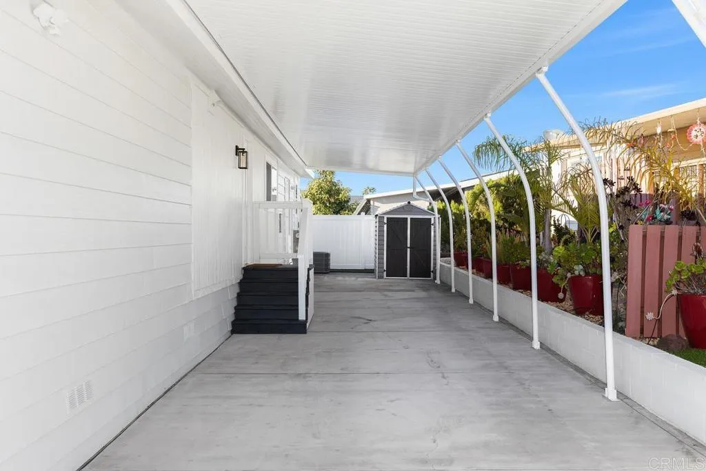 7144 Santa Rosa, Unit 86 Carlsbad, CA 92011 - Photo 34 of 41 a view of a house with porch