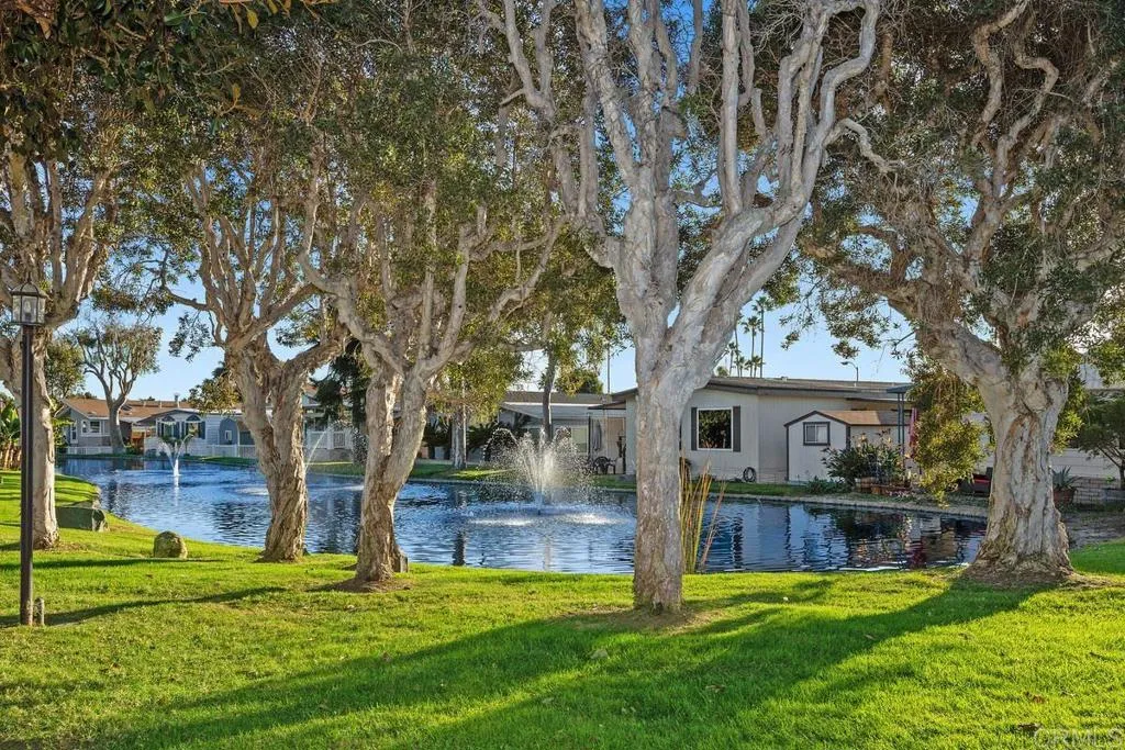 7144 Santa Rosa, Unit 86 Carlsbad, CA 92011 - Photo 38 of 41 a view of a house with a yard