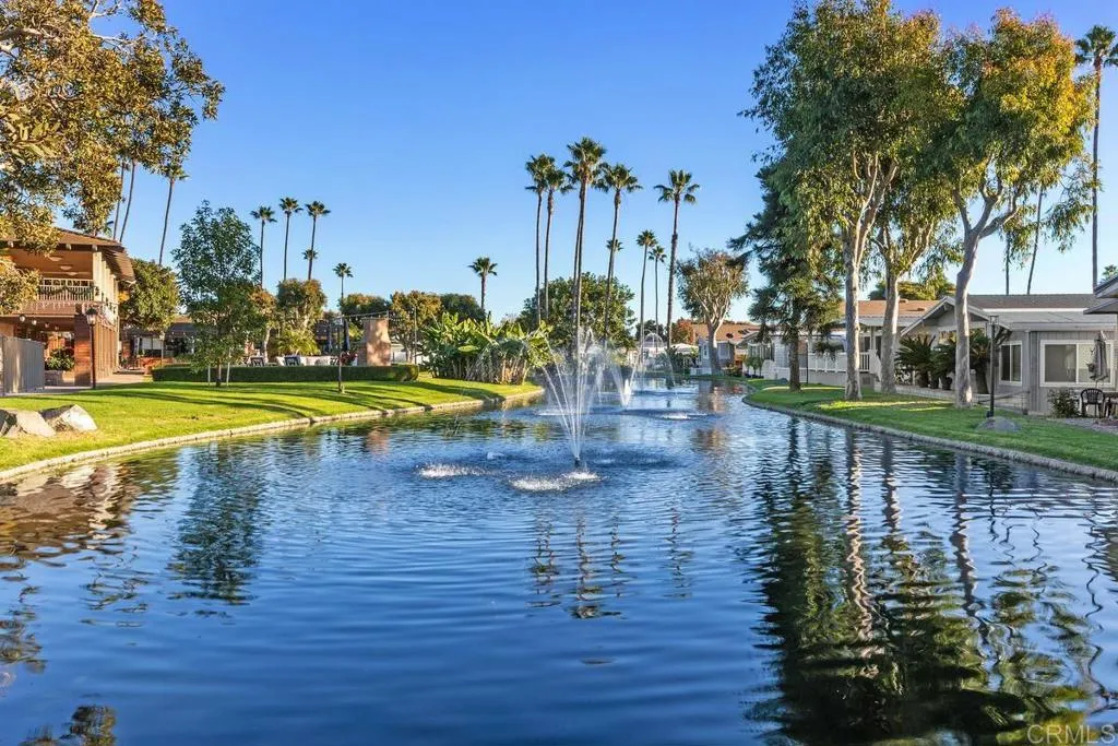 7144 Santa Rosa, Unit 86 Carlsbad, CA 92011 - Photo 39 of 41 a view of a swimming pool with an outdoor space and seating area