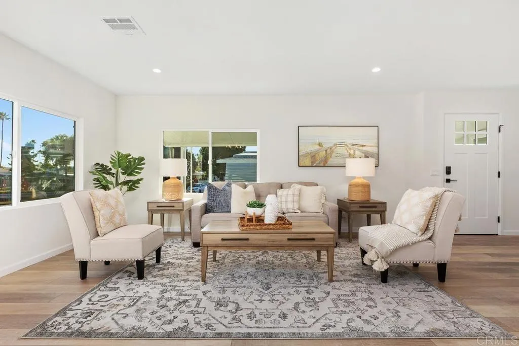 7144 Santa Rosa, Unit 86 Carlsbad, CA 92011 - Photo 4 of 41 a living room with furniture and a rug