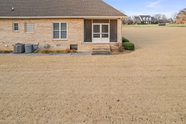 a view of front of house with a yard