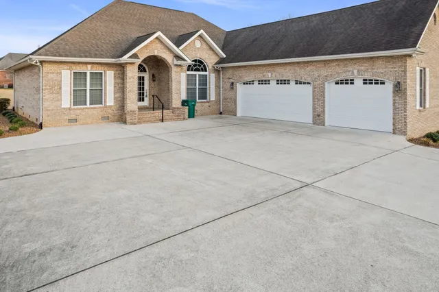 an aerial view of a residential houses with outdoor space