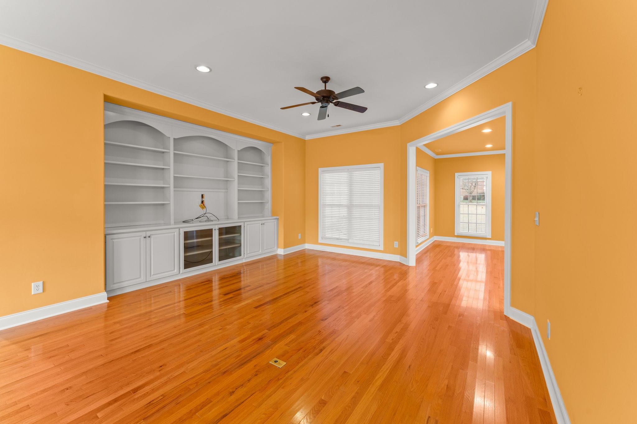 657 Pickney Road Winchester, TN 37398 - Photo 33 of 66 a view of a livingroom with wooden floor a ceiling fan and windows