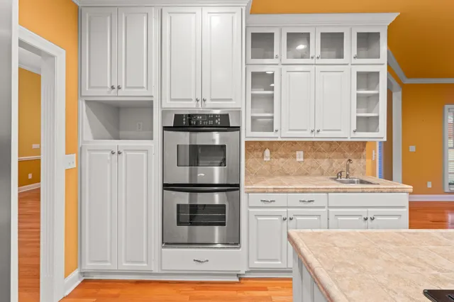 a view of a big room with a ceiling fan and entryway