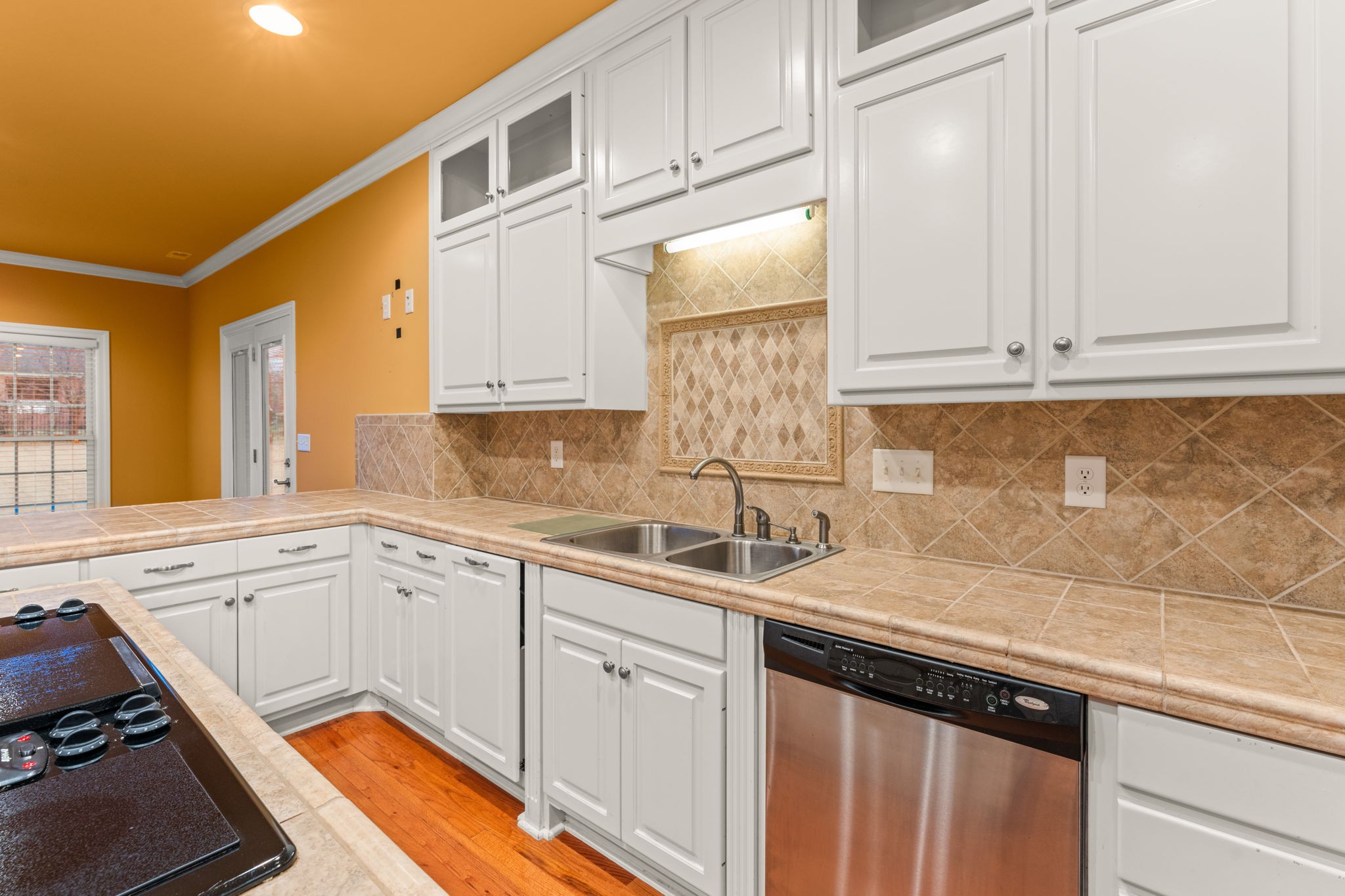657 Pickney Road Winchester, TN 37398 - Photo 45 of 66 a kitchen with granite countertop a sink stainless steel appliances white cabinets and a window