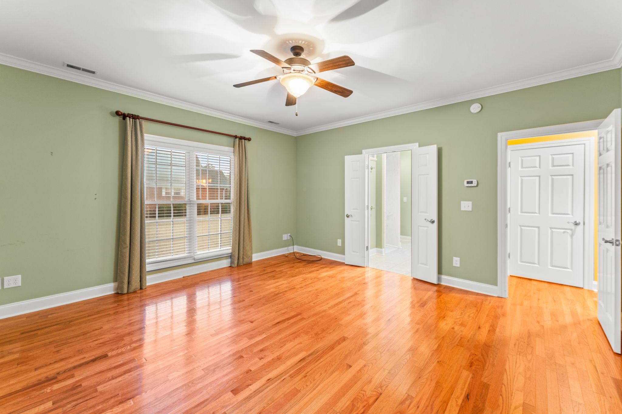 657 Pickney Road Winchester, TN 37398 - Photo 48 of 66 a view of an empty room with wooden floor and a window