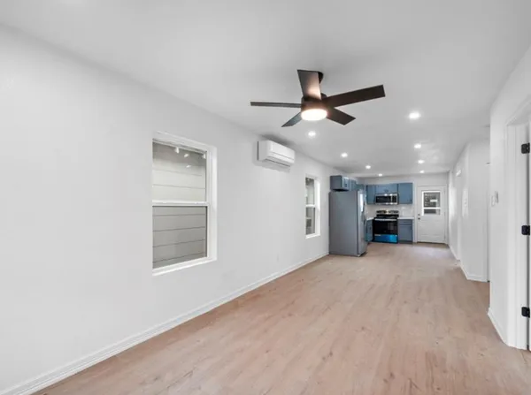 a view of an empty room with a window