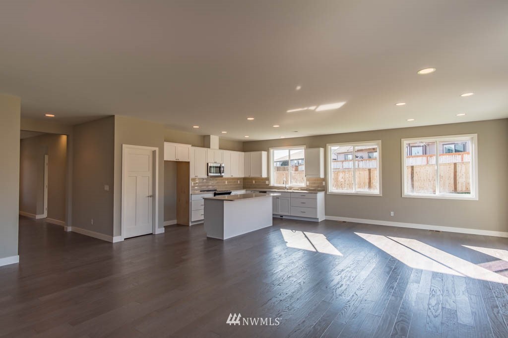 40 Lillian Ridge Court Sequim, WA 98382 - Photo 8 of 23 a room with stainless steel appliances kitchen island wooden floors and view living room