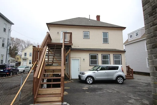 a view of a car parked in front of a house