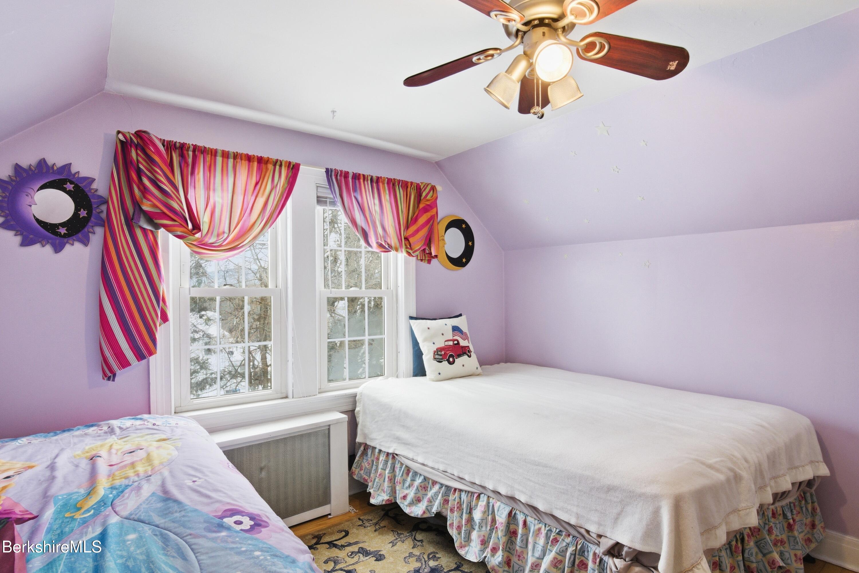 53 Edison Avenue Pittsfield, MA 01201 - Photo 19 of 45 a bedroom with a bed and a chandelier
