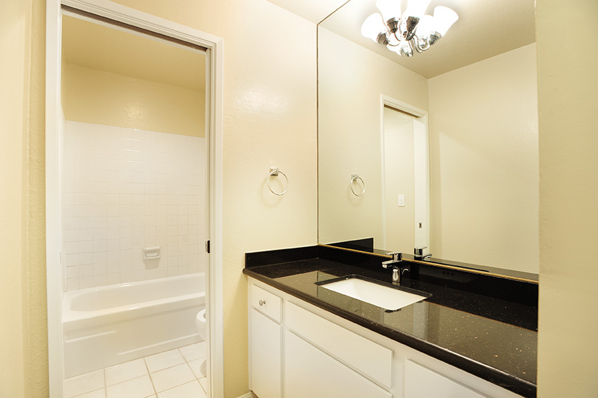 3375 Foothill Road, Unit 811 Carpinteria, CA 93013 - Photo 12 of 15 a bathroom with a sink and a mirror