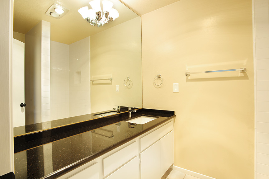 3375 Foothill Road, Unit 811 Carpinteria, CA 93013 - Photo 14 of 15 a bathroom with a sink a mirror and a shower