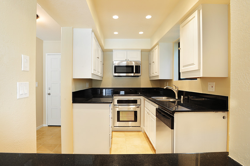3375 Foothill Road, Unit 811 Carpinteria, CA 93013 - Photo 3 of 15 a kitchen with a stove and a microwave