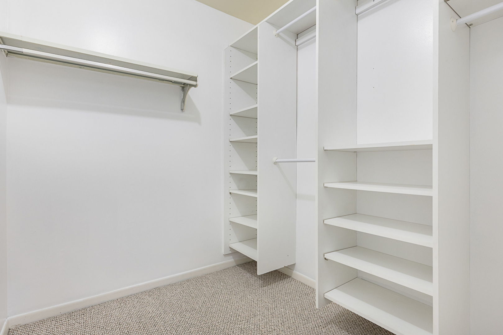 801 79th Street, Unit 103 Darien, IL 60561 - Photo 11 of 19 a view of walk in closet with empty racks