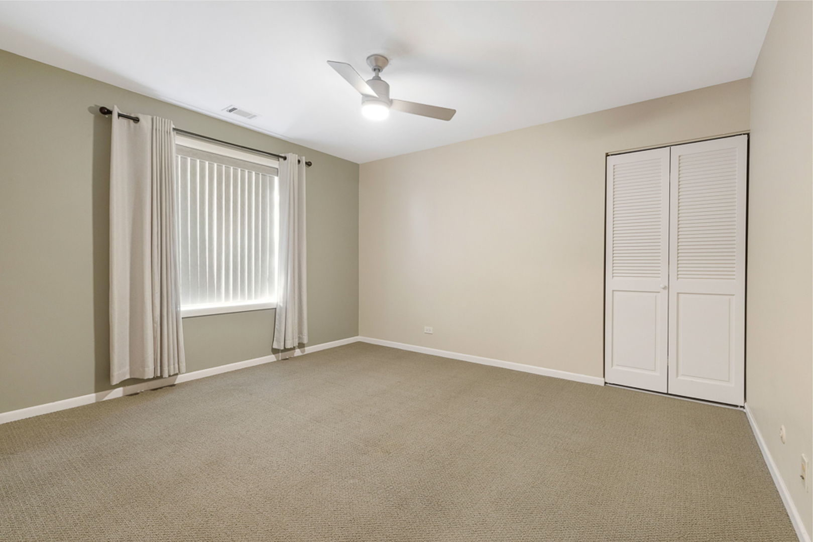 801 79th Street, Unit 103 Darien, IL 60561 - Photo 13 of 19 a view of an empty room with a window