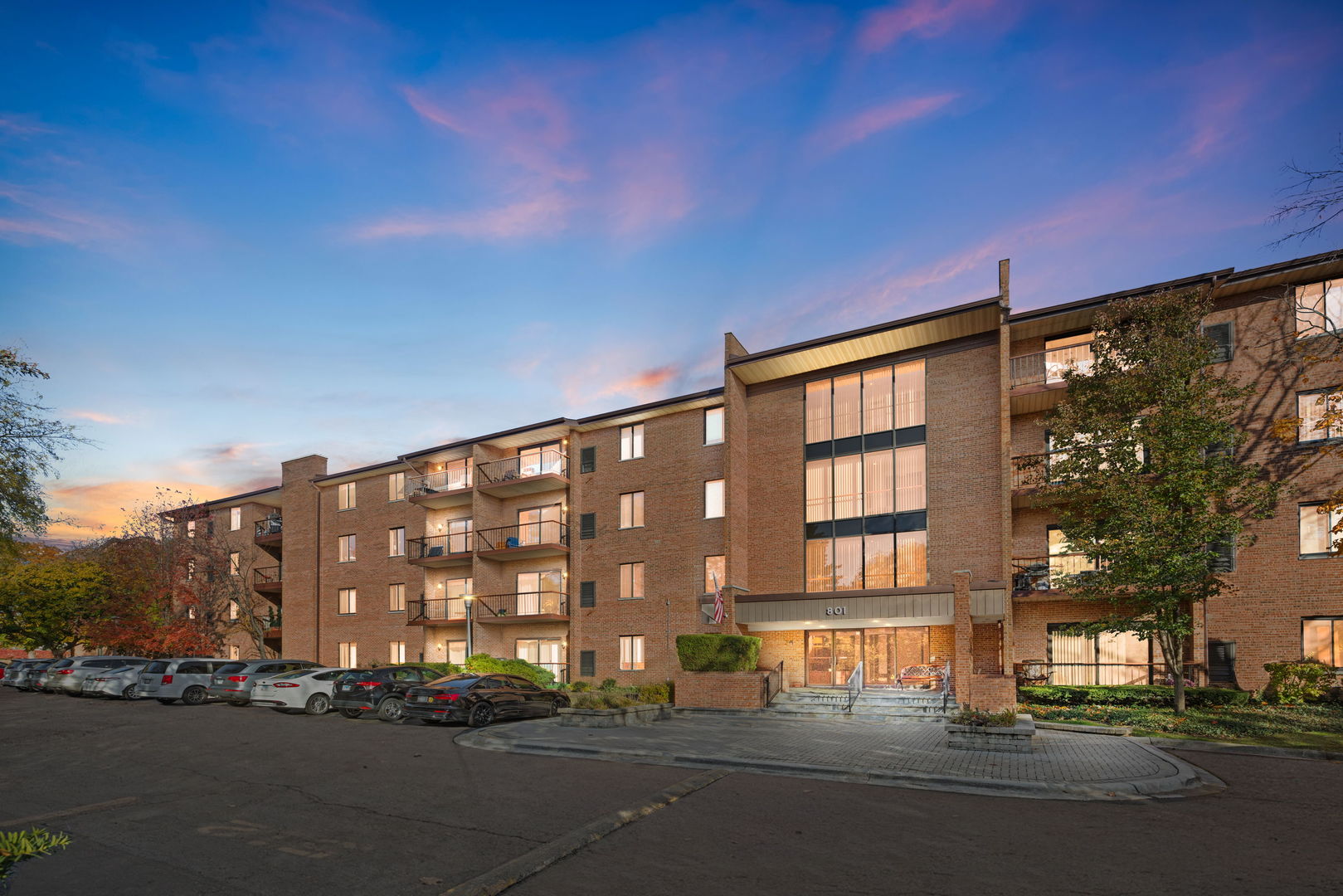 801 79th Street, Unit 103 Darien, IL 60561 - Photo 19 of 19 a city street lined with tall buildings