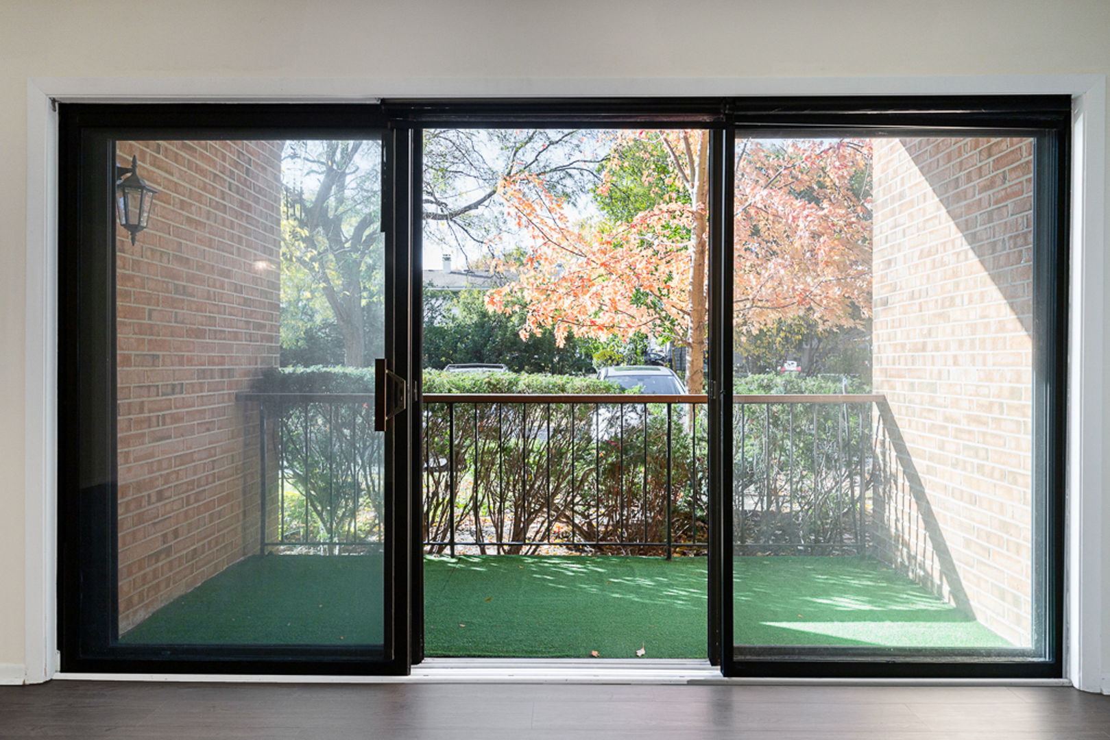 801 79th Street, Unit 103 Darien, IL 60561 - Photo 3 of 19 a view of a room with a large window and wooden floor