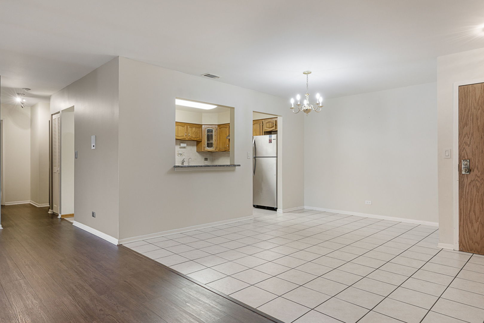 801 79th Street, Unit 103 Darien, IL 60561 - Photo 5 of 19 a view of a livingroom with wooden floor