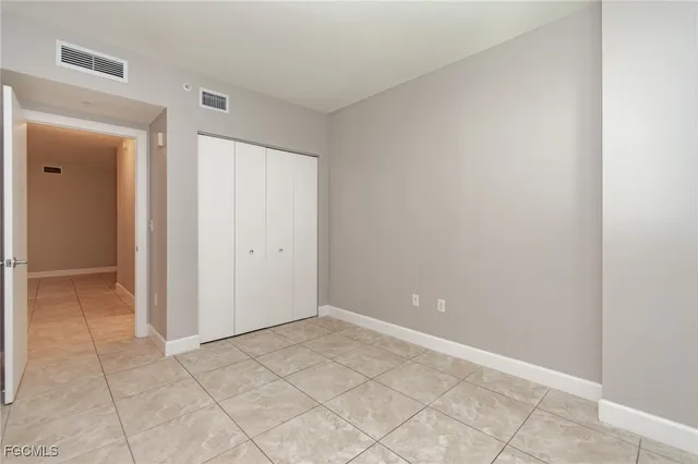 a view of a hallway with closet area