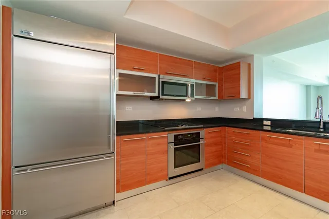 a kitchen with a stove and a microwave