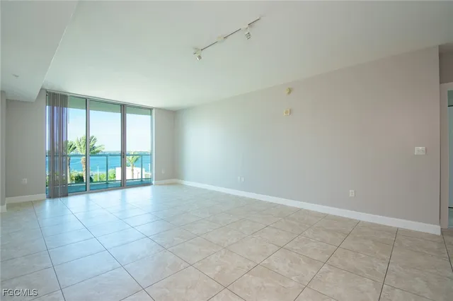 a view of an empty room and a window