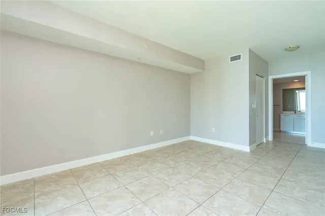 a bathroom with a granite countertop sink a shower and a mirror