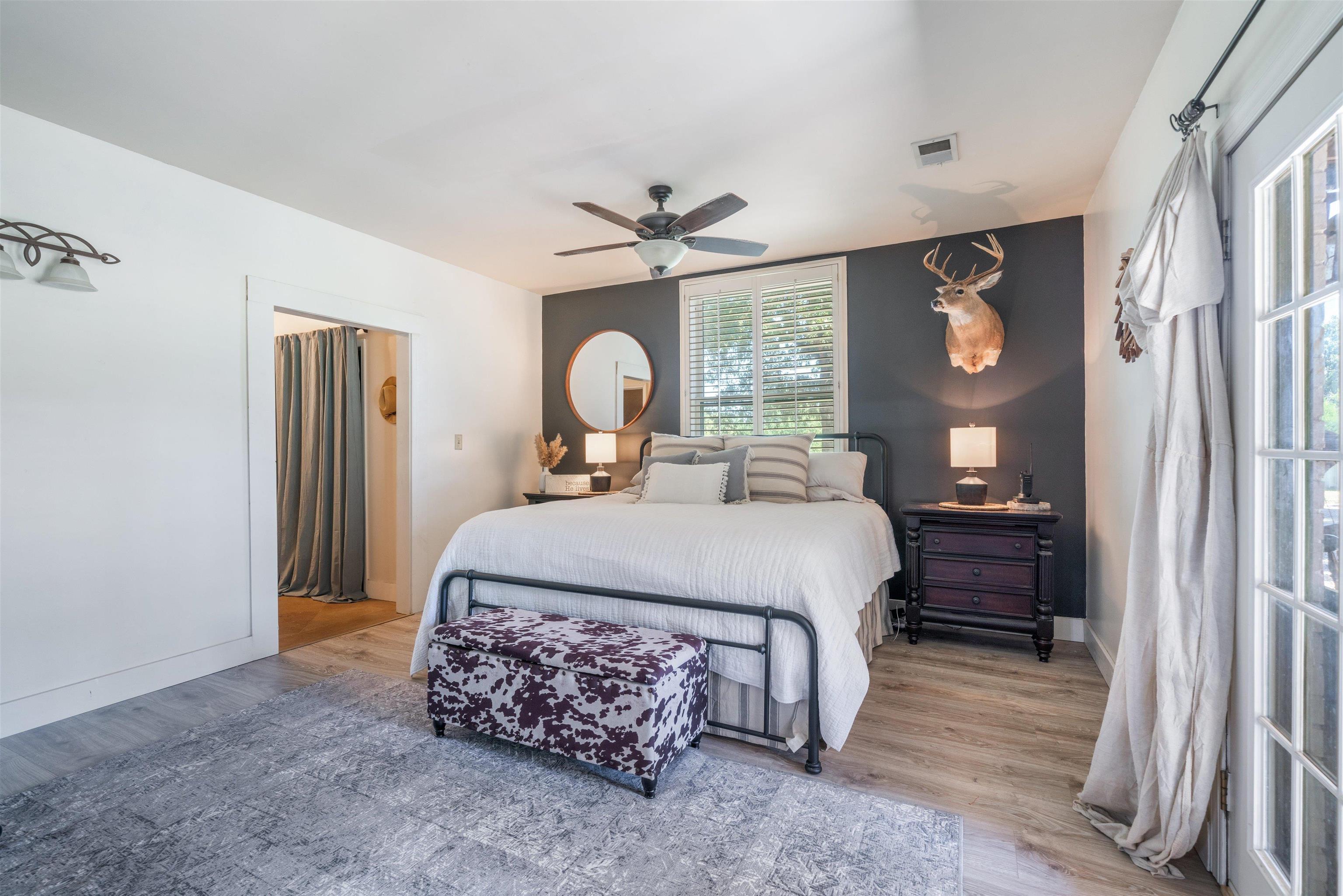 10275 Moose Road Millington, TN 38053 - Photo 11 of 25 a bedroom with a bed and a chandelier