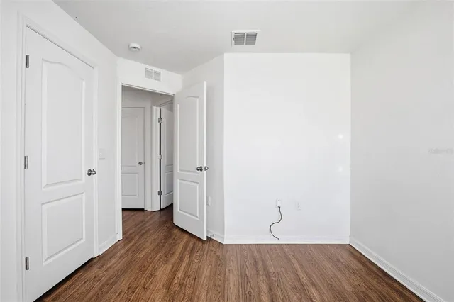 a view of room with hardwood floor