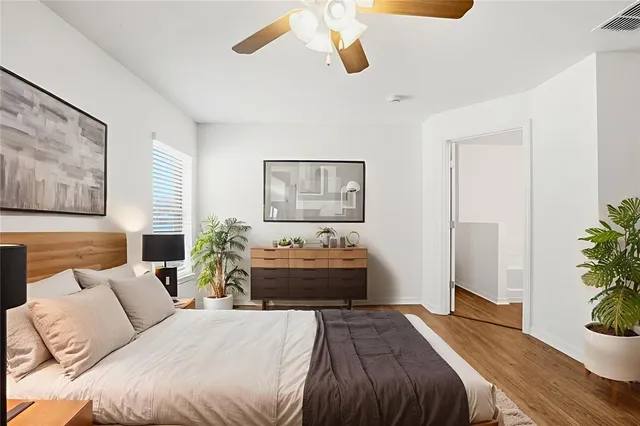 a bedroom with a bed and a couch