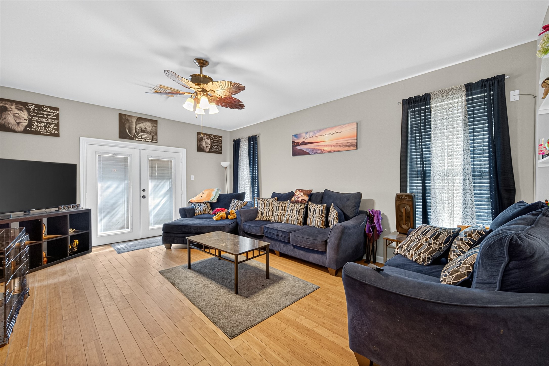 907 Morley Park Lane Spring, TX 77373 - Photo 11 of 44 a living room with furniture and a flat screen tv with wooden floor
