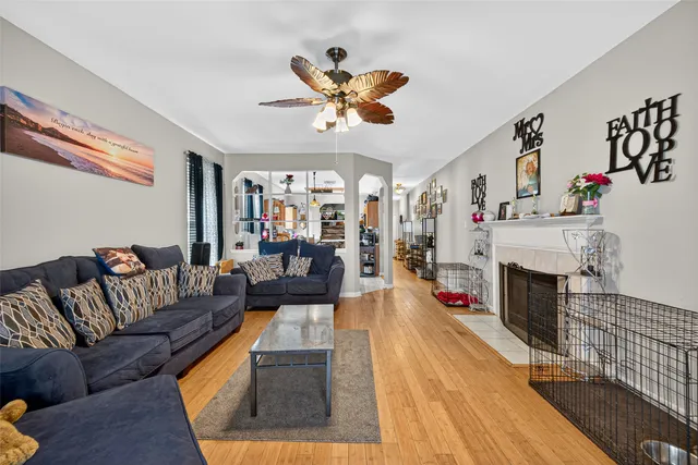 a living room with fireplace furniture and a fireplace