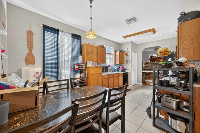a dining room with furniture and wooden floor