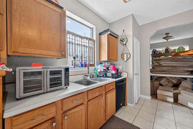 a kitchen with stainless steel appliances a sink and cabinets