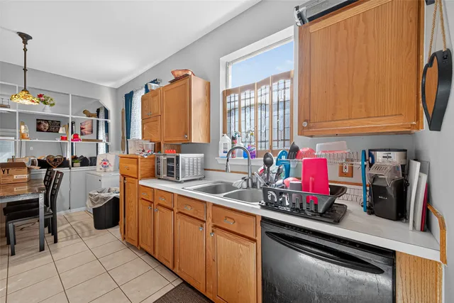 a kitchen that has a sink and a stove in it