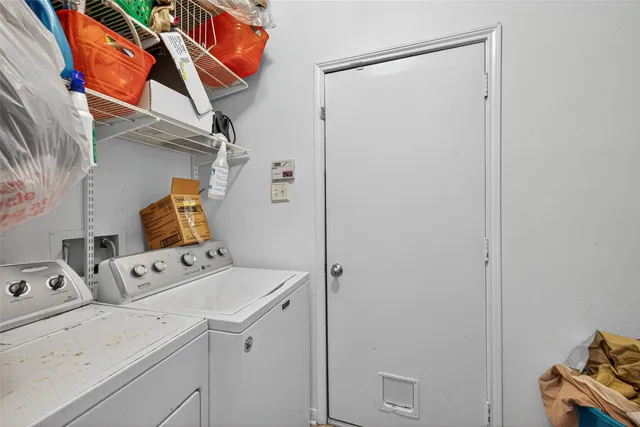 a utility room with dryer and washer