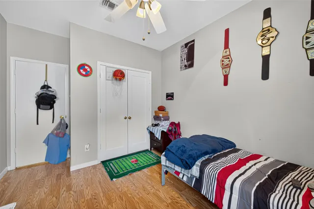 a bed room with a bed and a desk