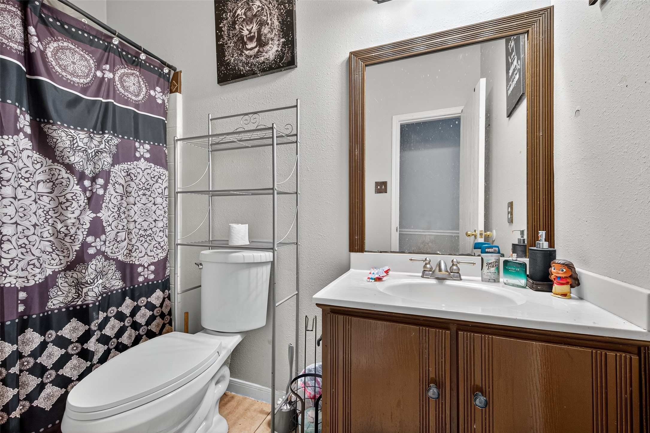 907 Morley Park Lane Spring, TX 77373 - Photo 31 of 44 a bathroom with a sink vanity mirror and toilet