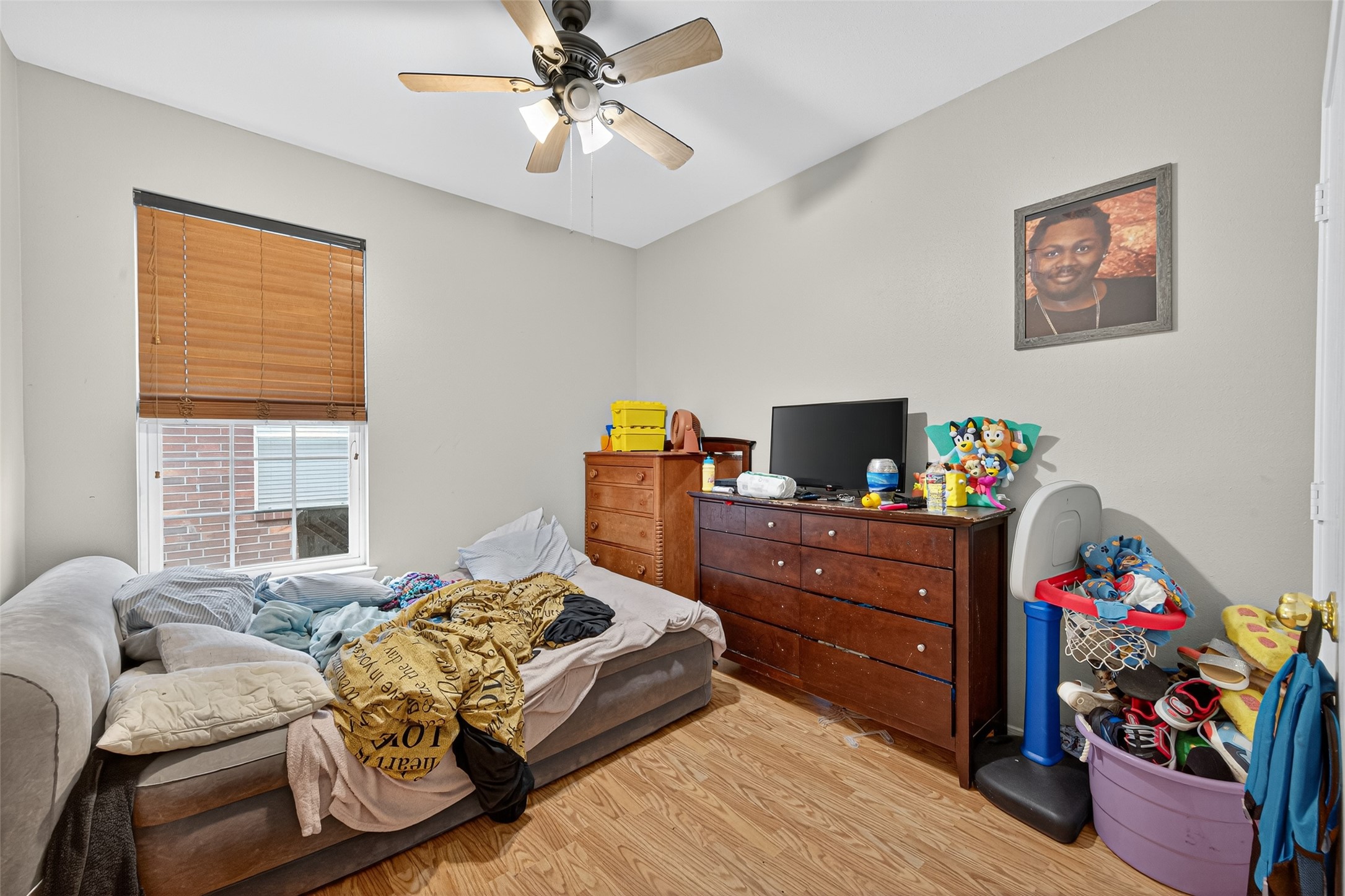 907 Morley Park Lane Spring, TX 77373 - Photo 32 of 44 a bedroom with a bed and wooden floor