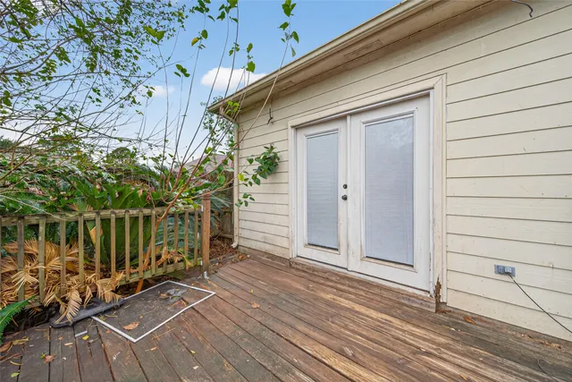 a view of balcony with wooden floor and outdoor seating