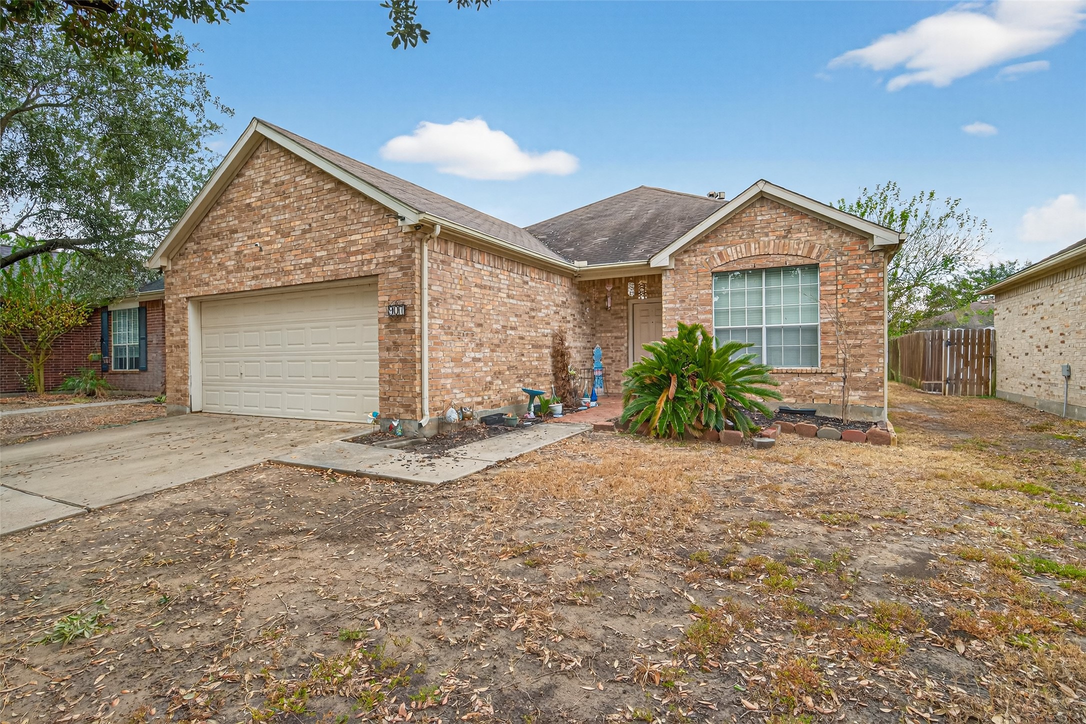 907 Morley Park Lane Spring, TX 77373 - Photo 6 of 44 a view of a house with a yard and garage