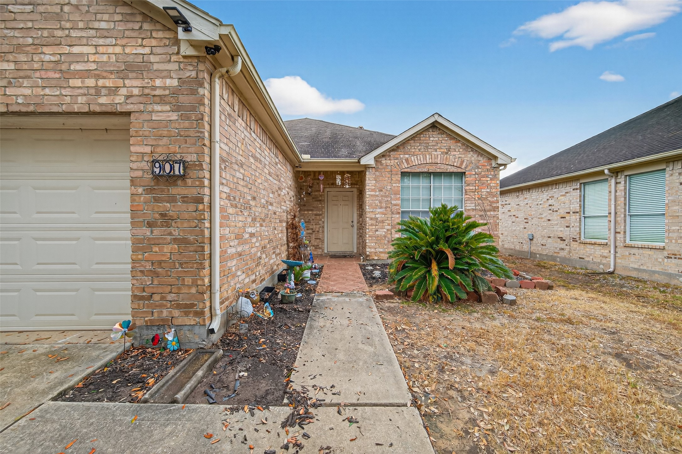 907 Morley Park Lane Spring, TX 77373 - Photo 7 of 44 a view of a house with a small yard plants and large tree