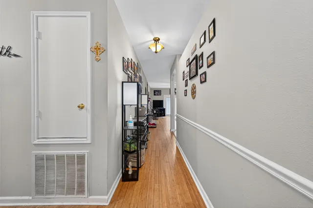 a view of entryway with stairs and wooden floor
