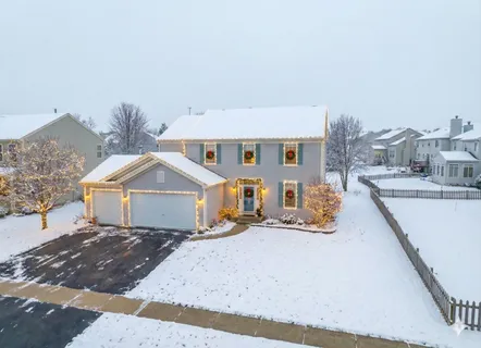 an arial view of a house with a yard