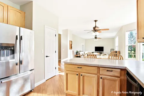 a kitchen with a sink appliances and cabinets