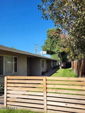 a view of a house with a tree